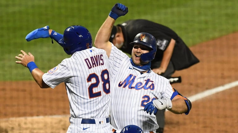 Mets designated hitter Pete Alonso celebrates his two-run home run...