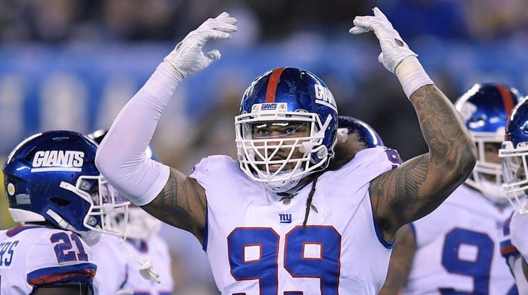 Giants defensive end Leonard Williams motions after a play against...