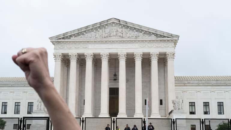 A demonstrator outside the Supreme Court in Washington, D.C., on...