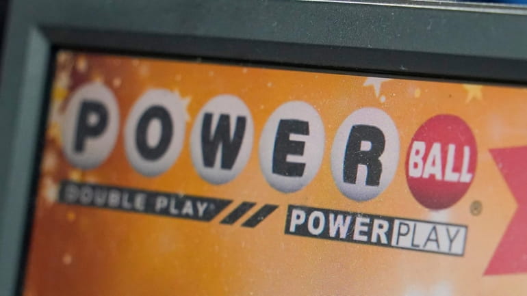 A display panel advertises tickets for a Powerball drawing at...