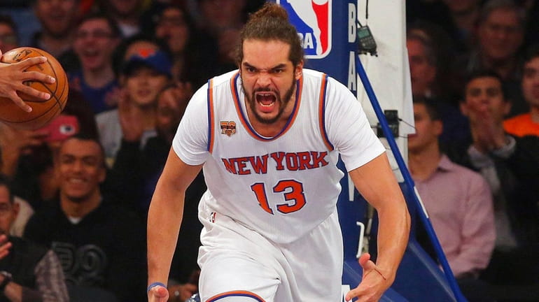 Joakim Noah #13 of the New York Knicks reacts after...
