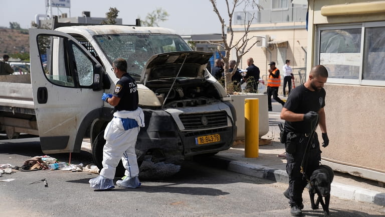 Israeli security forces inspect the scene of a Palestinian ramming...
