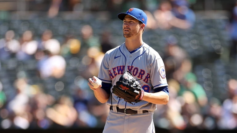 Jacob deGrom of the New York Mets stands on the...