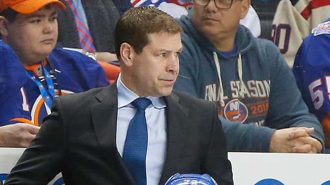 Islanders head coach Doug Weight looks on in the first...