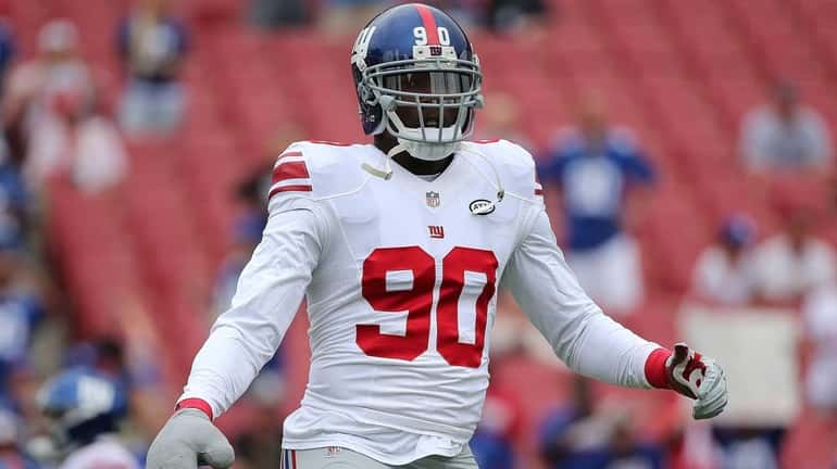 Jason Pierre-Paul #90 of the New York Giants warms up...