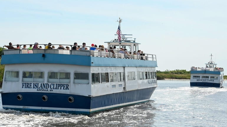 Ferries head to Fire Island from the Sayville Ferry Terminal...