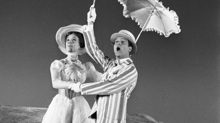  Dick Van Dyke (left) is airborne during a dance with Julie...