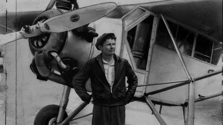 1938: Douglas (WrongWay) Corrigan stands next to plane at Roosevelt...