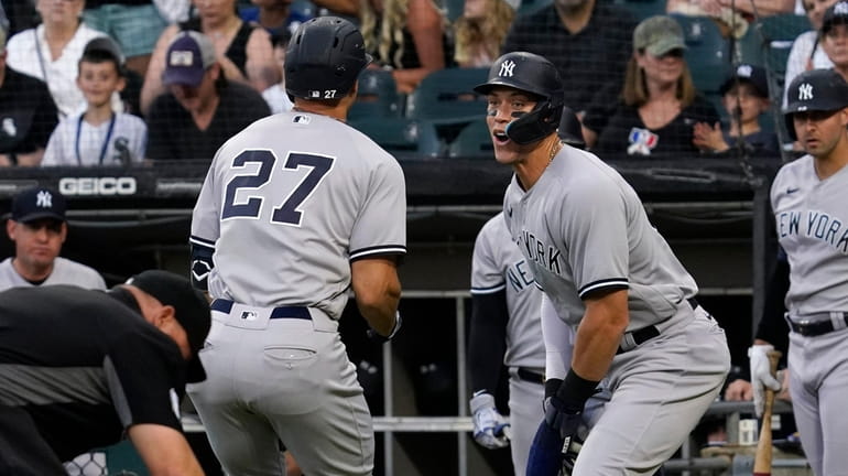 Yankees' Giancarlo Stanton (27) celebrates with Aaron Judge after hitting...
