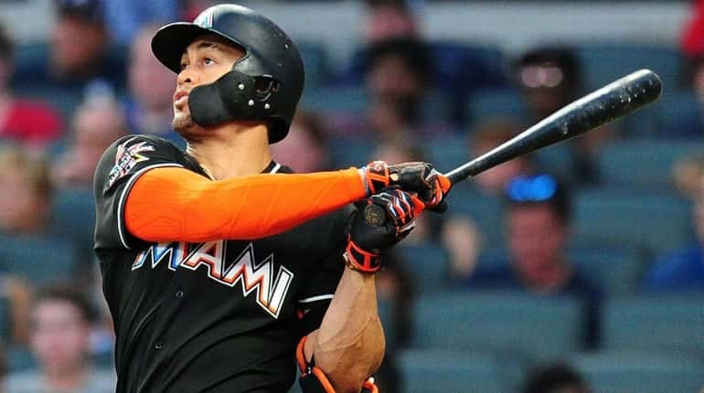 Giancarlo Stanton hits a sixth-inning solo home run against the...
