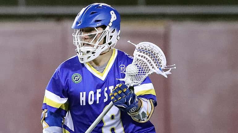 Hofstra's Jimmy Yanes drives from behind the net against Stony...