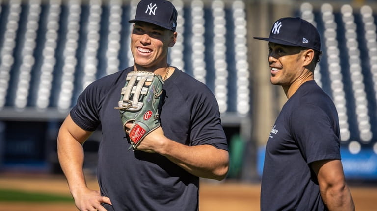 Yankees’ Aaron Judge and Giancarlo Stanton speak at the team...