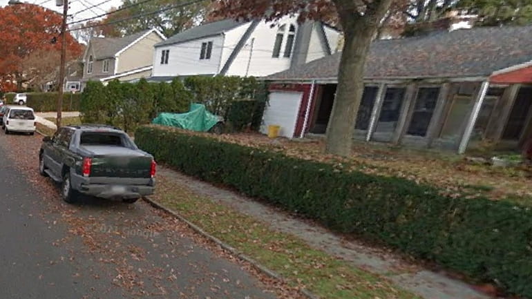 This image from Google Maps shows a Chevy Avalanche parked...