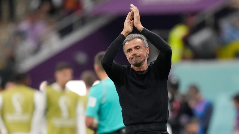 Spain's head coach Luis Enrique claps his hands during the...