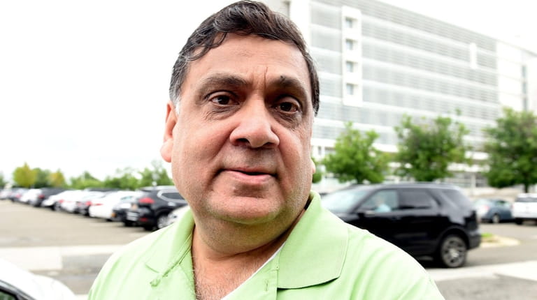 Harendra Singh leaves federal court in Central Islip in August 2018.