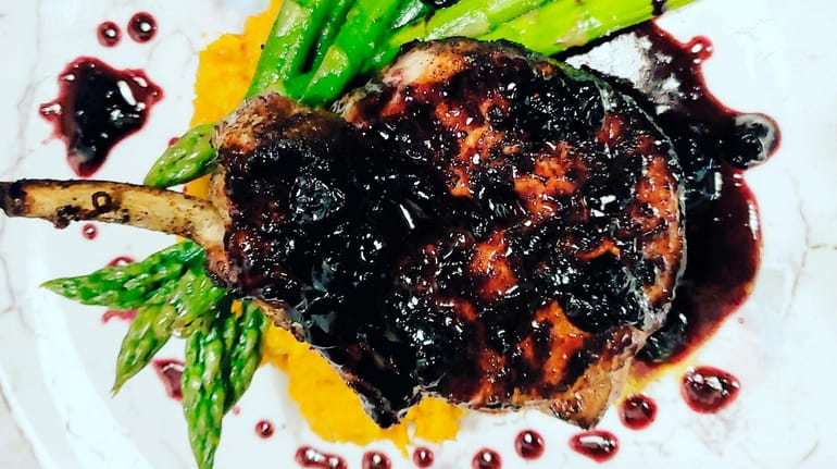 The grilled pork chop with blueberry chutney at Roc &...