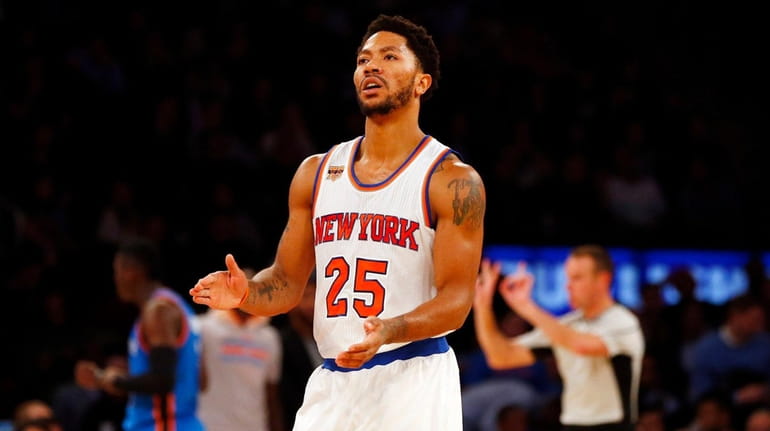 Derrick Rose #25 of the New York Knicks reacts after...