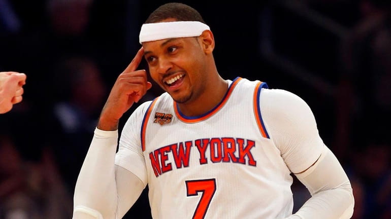 Carmelo Anthony #7 of the New York Knicks reacts after...