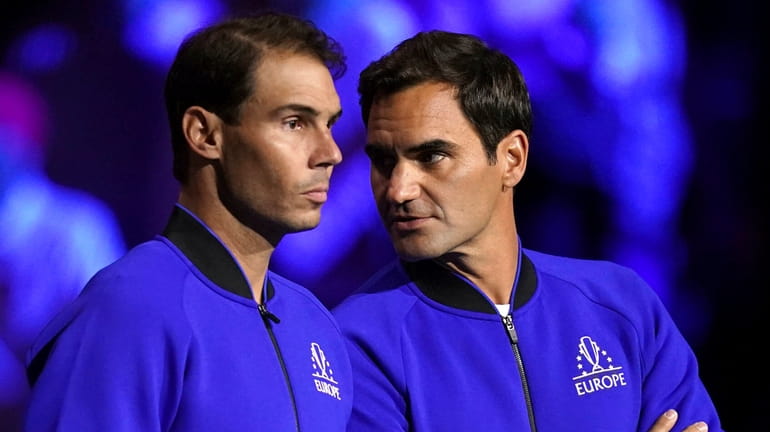 Team Europe's Rafael Nadal and Roger Federer line up on...