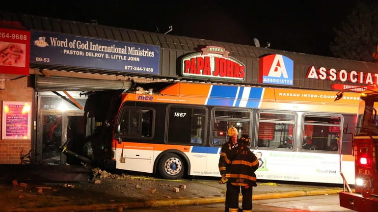 A Nassau County bus crashed into a Papa John's store...