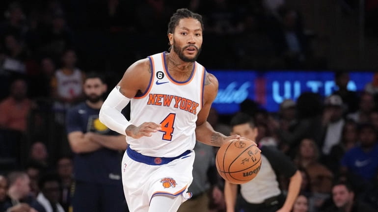 Derrick Rose of the NY Knicks with the ball against...