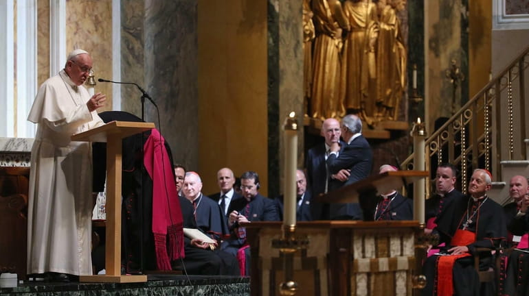 Pope Francis speaks to bishops during the midday prayer service...