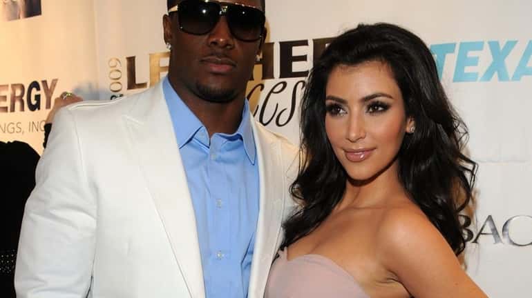 NFL player Reggie Bush and co-host Kim Kardashian attend 6th...