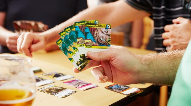 Patrons play a card game at Destination Unknown Brewing Company...