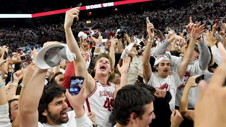 Arkansas' Lawson Blake (45) celebrates with fans after defeating Duke...
