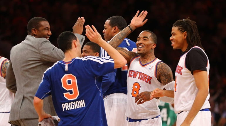 J.R. Smith celebrates after hitting a three-point shot to end...
