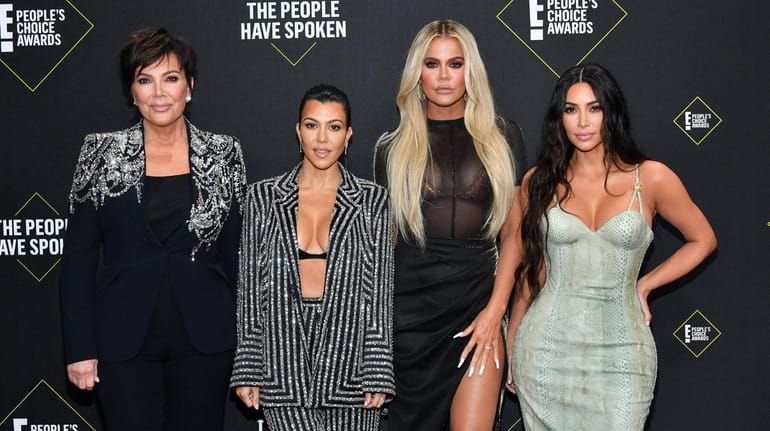 Kourtney, left, Khloé and Kim Kardashian attend the 2019 E!...
