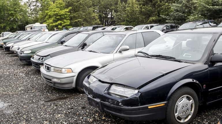 Cars are seen at the Suffolk County Police Impound section...