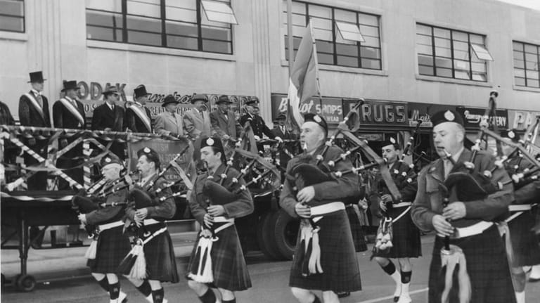A group of Kilties march past the reviewing stand on...