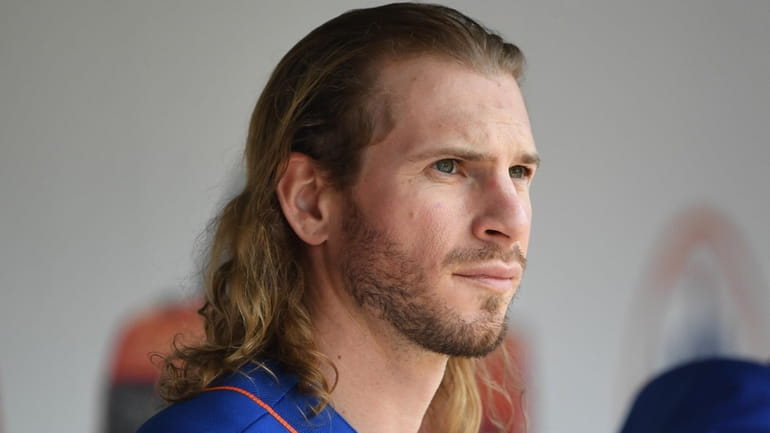 Mets centerfielder Travis Jankowski looks on from the dugout during...