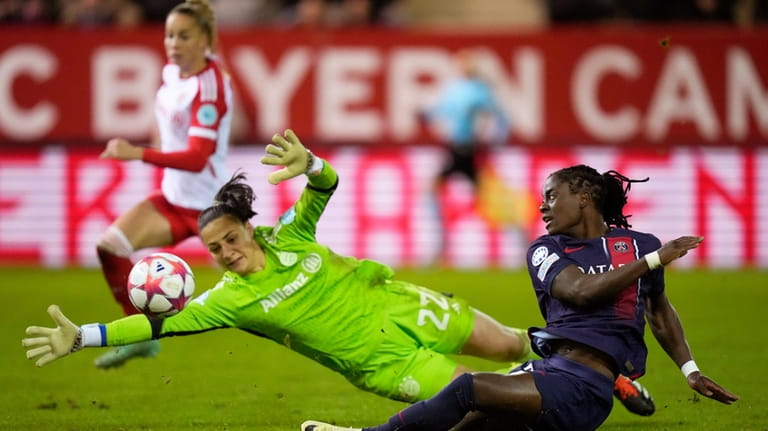 PSG's Tabitha Chawinga, right, scores her side's first goal past...