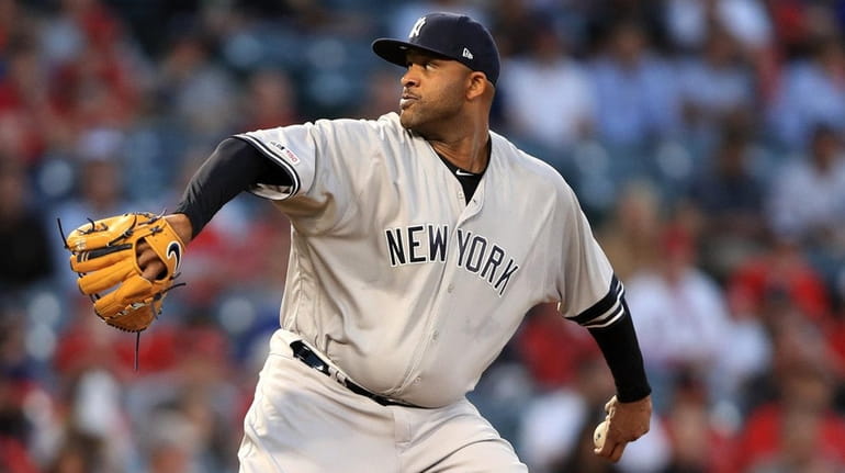 CC Sabathia of the Yankees pitches during the first inning of...