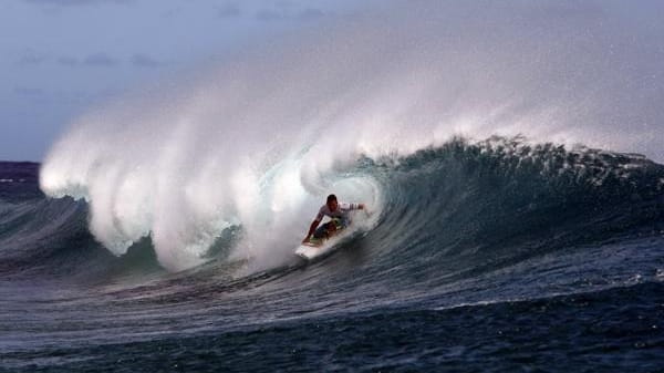 Andy Irons competes performs during the final of the Billabong...