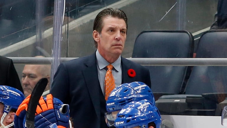 Islanders coach Lane Lambert looks on against the Calgary Flames at...
