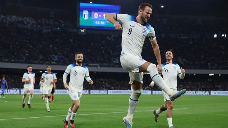 England's Harry Kane, second right, celebrates after scoring to 0-2...