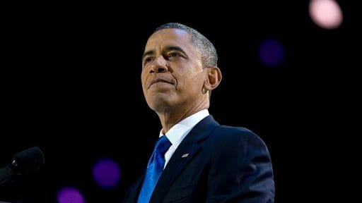 President Barack Obama pauses as he speaks at the election...