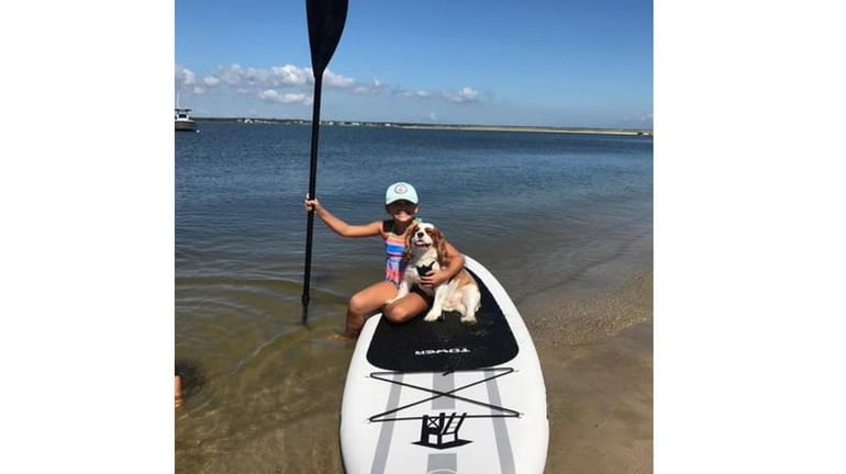 Kidsday reporter Olivia Dragonette of Eastport Elementary School goes paddleboarding...