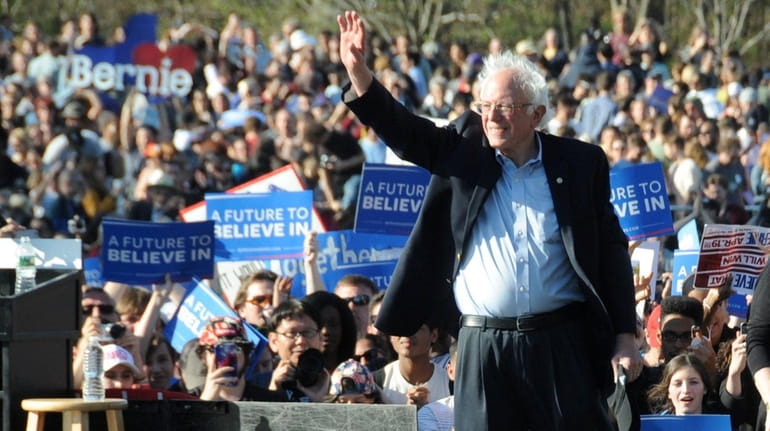 Democratic presidential candidate Bernie Sanders waves to supporters at a...