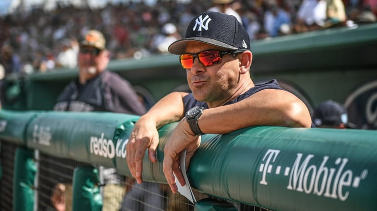 Yankees manager Aaron Boone in the dugout before a game against...