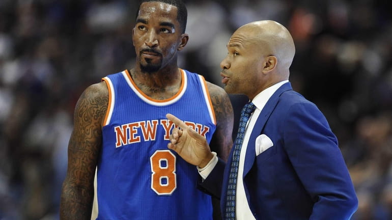 Knicks head coach Derek Fisher, right, talks with Knicks guard...