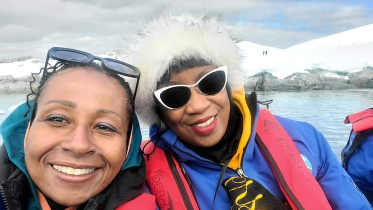 Women on a Sisters Traveling Solo trip kayak near glaciers...