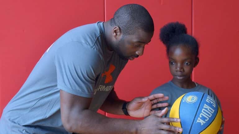 Knicks star Raymond Felton leads a free basketball clinic at...