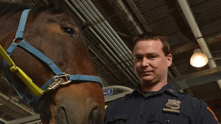 NYPD Police Officer Colin McCarty of Massapequa photographed with Fantan...