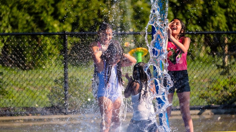 Kids cool off last summer at the Sgt. Paul Tuozzolo...