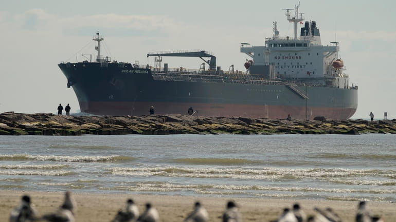 An oil tanker passes along a channel, March 2, 2022,...
