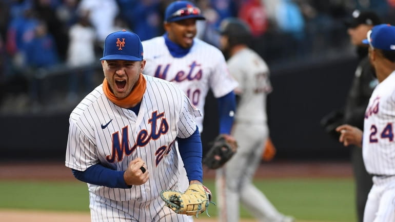 Mets' Pete Alonso reacts to a play at first being...
